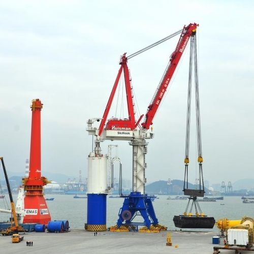 Grue sur quai flottant - Huisman - à portique