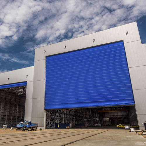 Porte pour chantier naval - Champion Door Oy  - coulissante verticale / semi-étanche / électrique